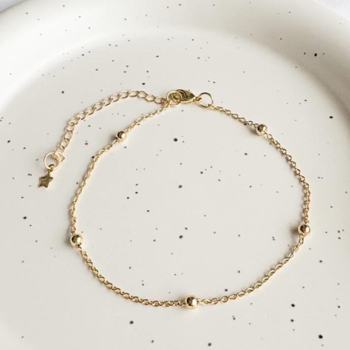 PULSEIRA MALHA C/ 5 BOLINHAS B. OURO